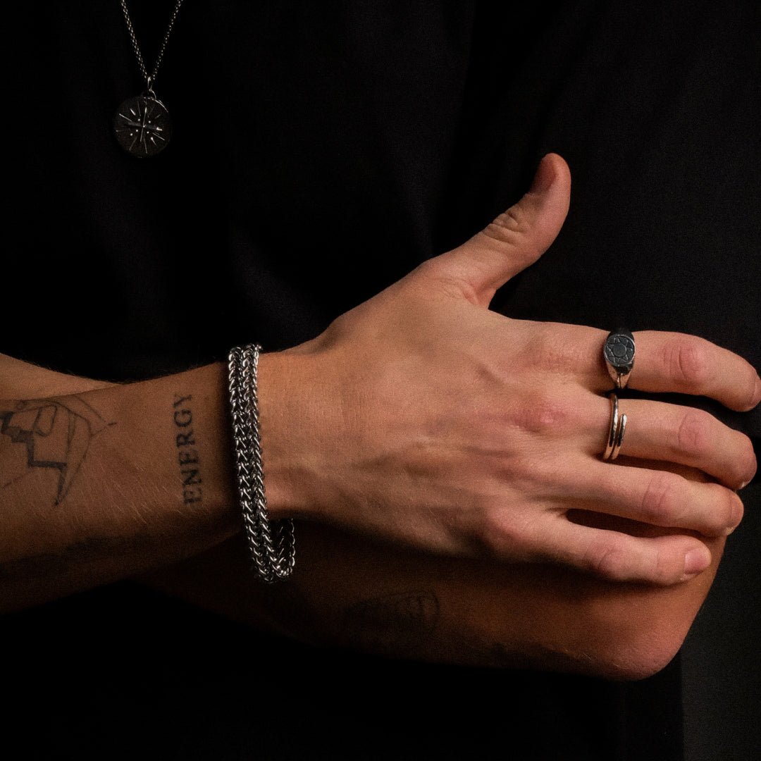 Relentless silver bracelet worn on wrist - 925 sterling silver bold bracelet men women | Wild Youth