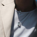 Feather silver necklace worn close-up - 925 sterling silver pendant men women | Wild Youth