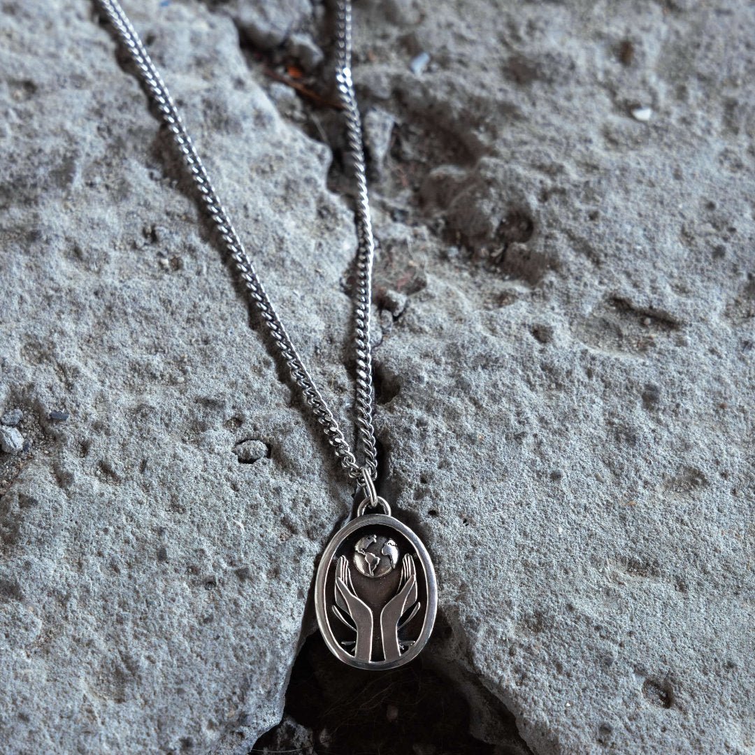 The World Is Yours silver globe pendant detail - 925 sterling silver chain | Wild Youth